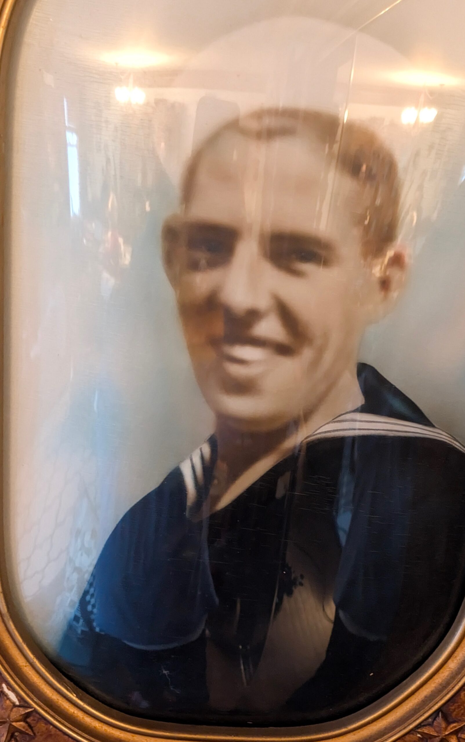 smiling man in navy uniform