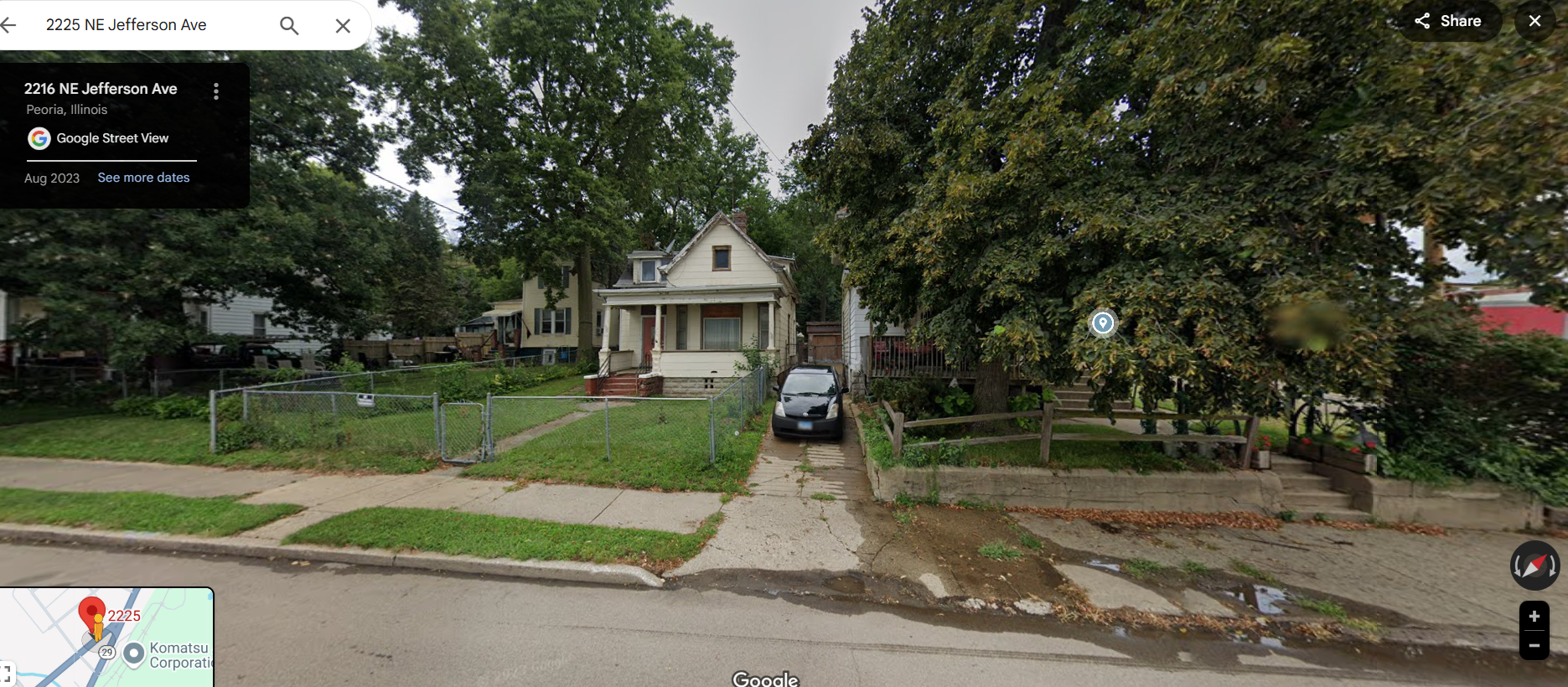 streetview of a house obscured by large trees