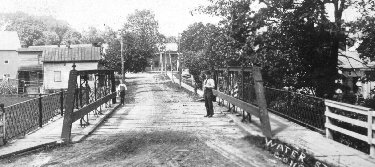 Man stands on bridge