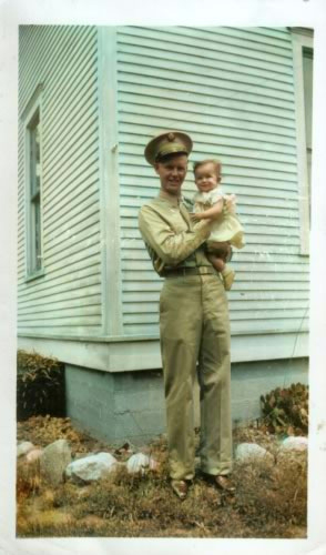 Soldier holding a baby