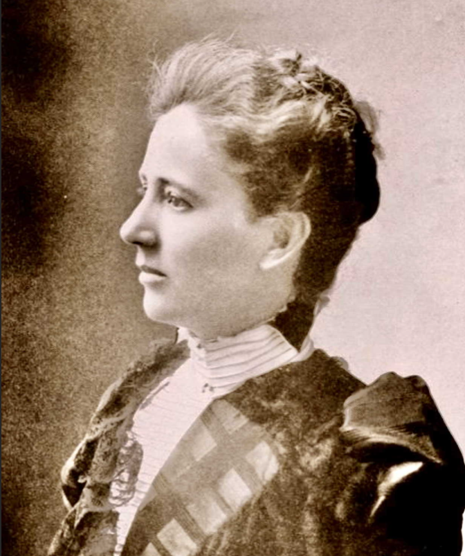 sepia portrait of a young woman dressed in clothing of the style in 1800s