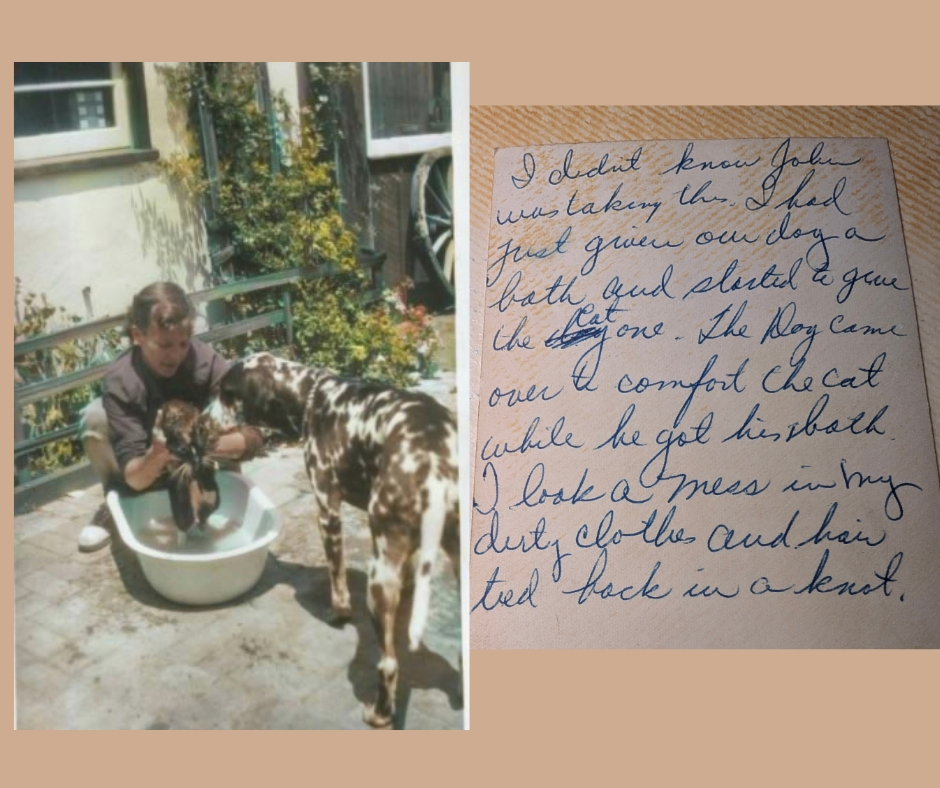 Back says "I didn't know John was taking this. I had just given our dog a bath and started to give the cat one. The dog came over to comfort the cat while he got his bath. I look a mess in my dirty clothes and hair tied back in a knot "