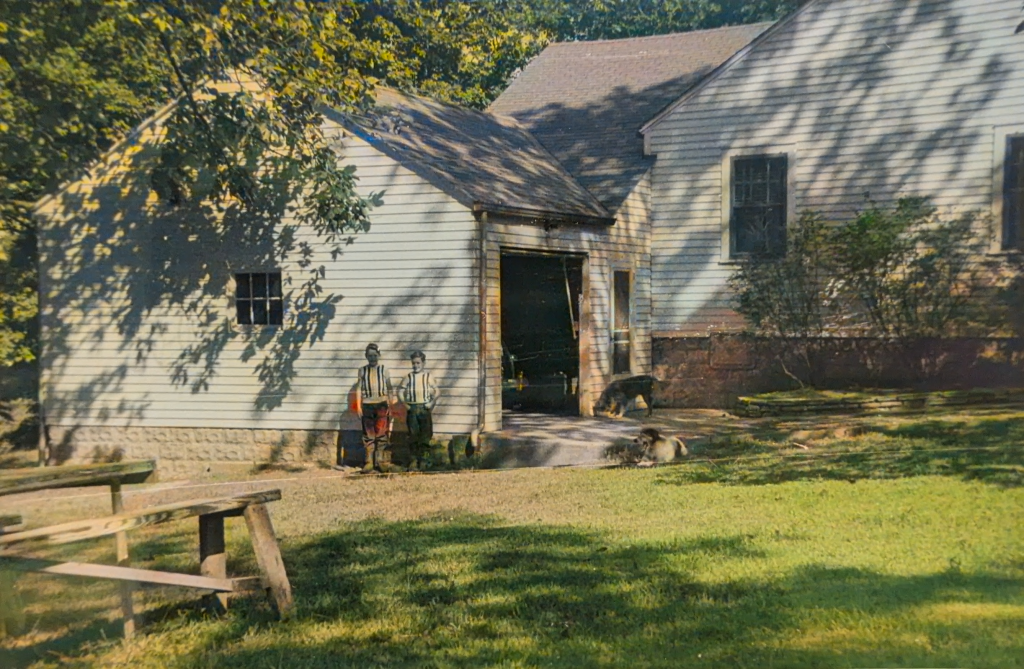 two boys stand by garage
