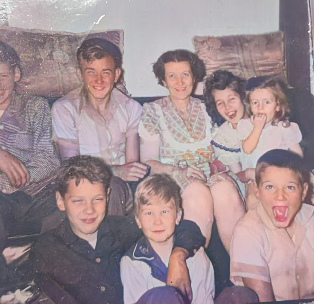 grandmother surrounded by 6 grandchildren